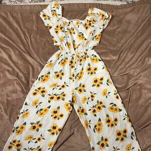 Girls white and yellow sunflower print wide-leg jumpsuit with a cutout bodice.
